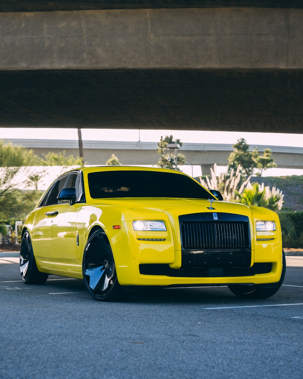 Rolls-Royce Ghost in a custom bright yellow vinyl wrap by Monarch Wrap & Tint in West LA