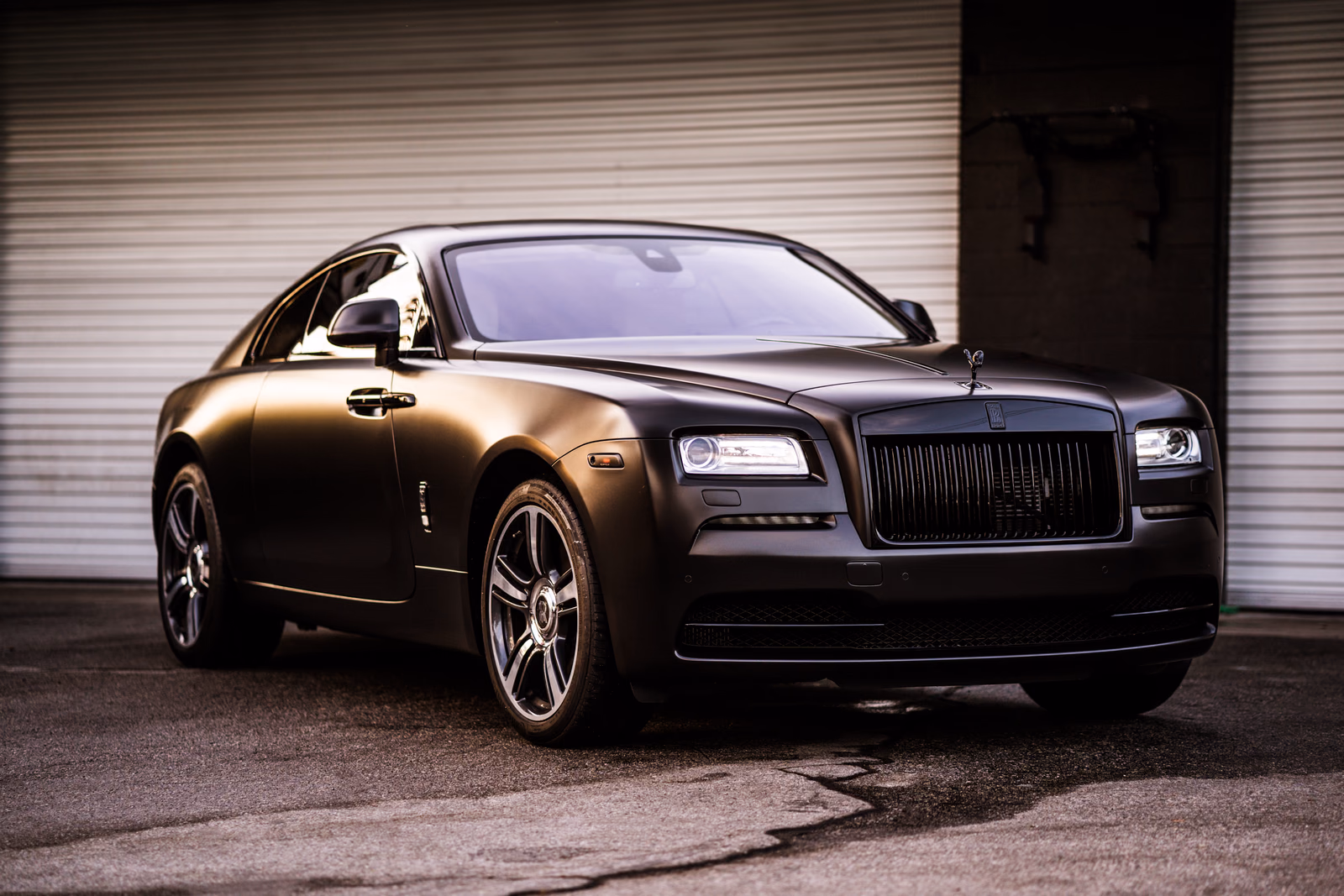 Rolls-Royce Wraith in a satin black full vinyl wrap by Monarch Wrap & Tint in West LA